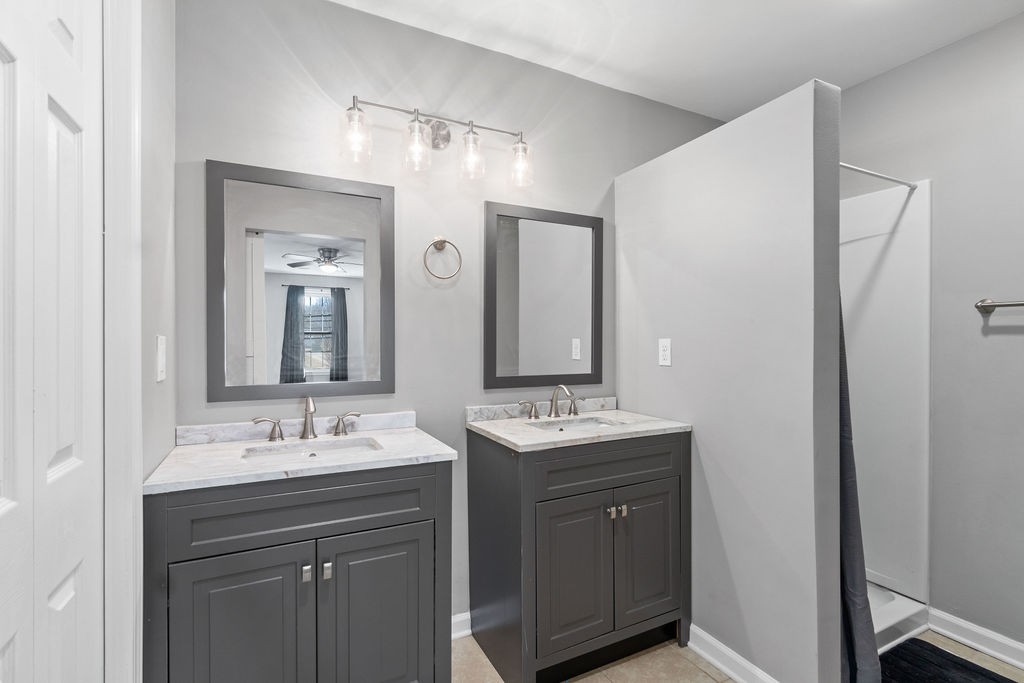1909 Needmore Road Clarksville, TN 37042 - Photo 17 of 24 a bathroom with a double vanity sink mirror and double