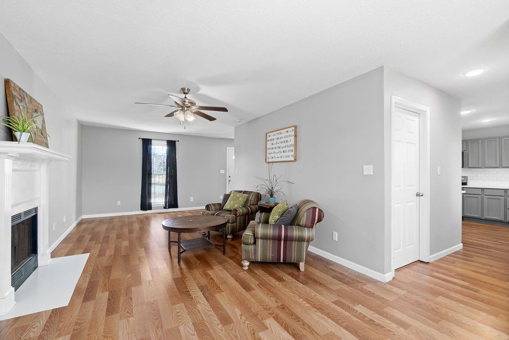 1909 Needmore Road Clarksville, TN 37042 - Photo 9 of 24 a living room with furniture and a fireplace
