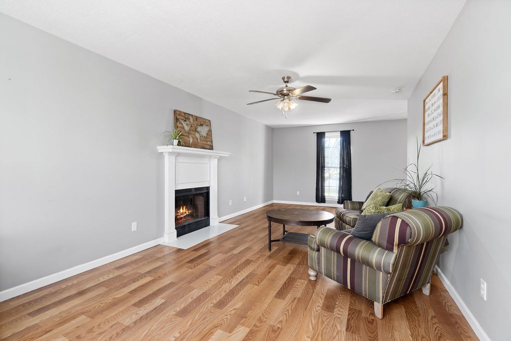 1909 Needmore Road Clarksville, TN 37042 - Photo 10 of 24 a living room with furniture and a fireplace