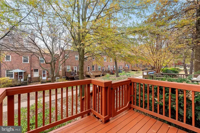 a view of wooden deck and a yard