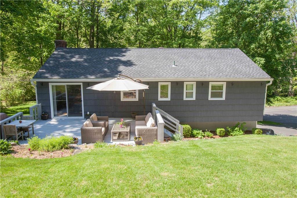 253 Bennetts Farm Road Ridgefield, CT 06877 - Photo 1 of 1 a front view of a house with a yard