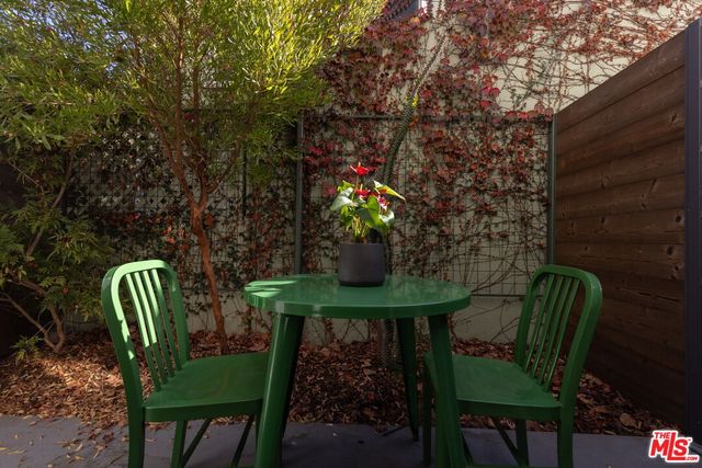 a view of a chairs and table in the patio