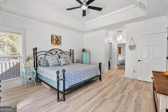 a bedroom with a bed and window