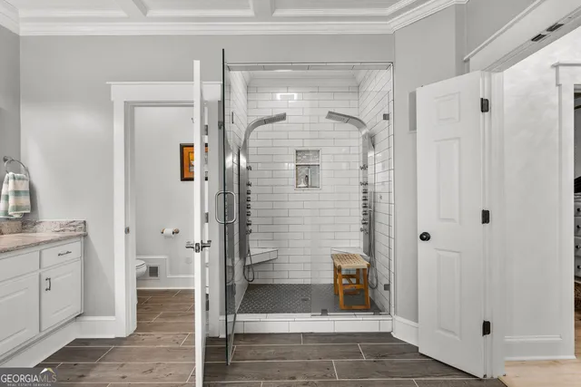 a bathroom with a shower and a sink