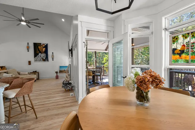 a dining room with furniture and window
