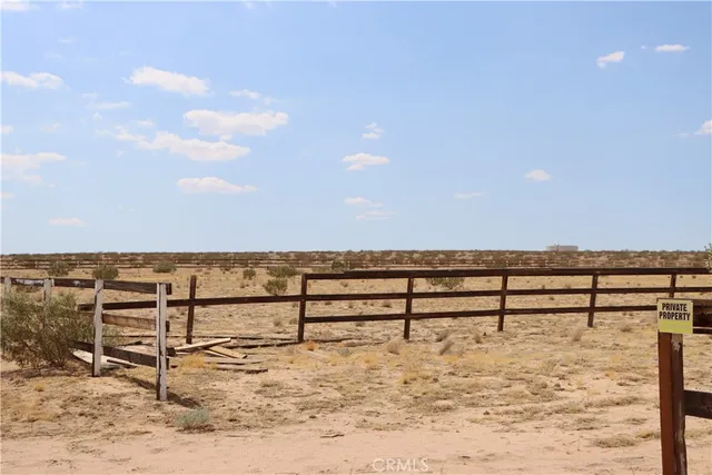 a view of ocean view with wooden fence