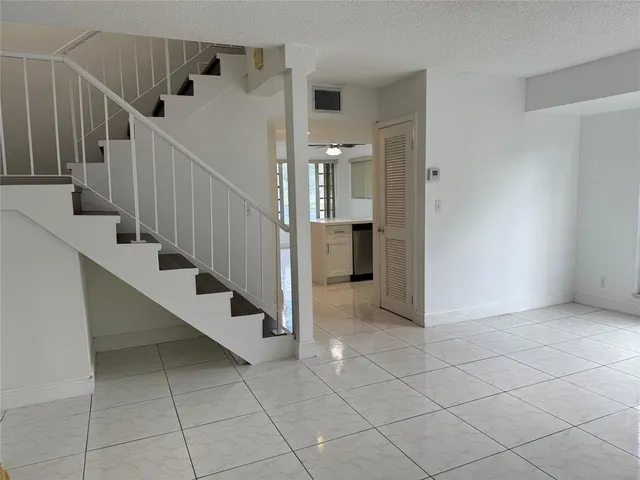 a view of entryway and hall with a window