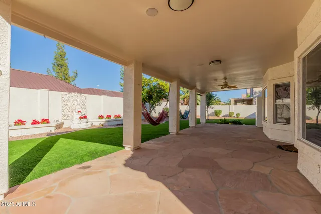 a view of a house with a yard and garage