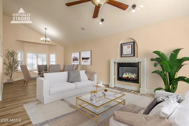 a living room with furniture and a fireplace