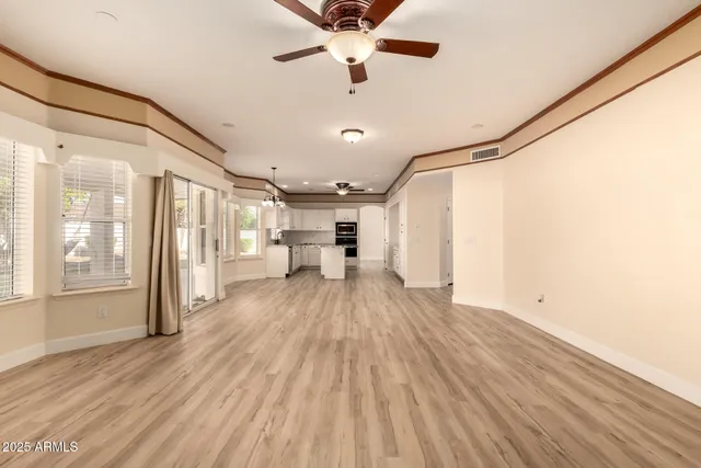 a view of a room with wooden floor