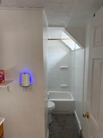 113 West Main Street, Unit 113 Ayer, MA 01432 - Photo 4 of 17 a bathroom with a shower and a toilet