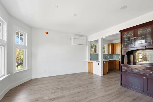 a view of a kitchen cabinets and wooden floor