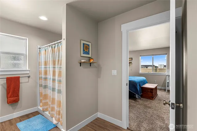 a view of a bedroom with furniture and windows