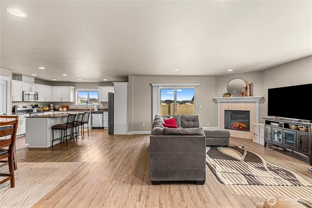 a living room with furniture and a flat screen tv