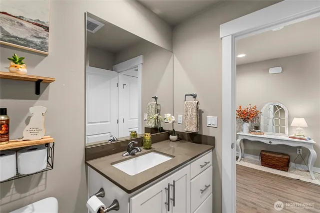 a bathroom with a sink and a mirror