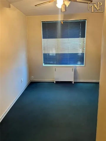 an empty room with wooden floor