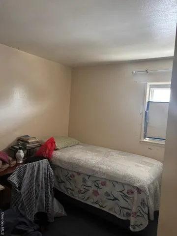 a bedroom with a bed and a closet