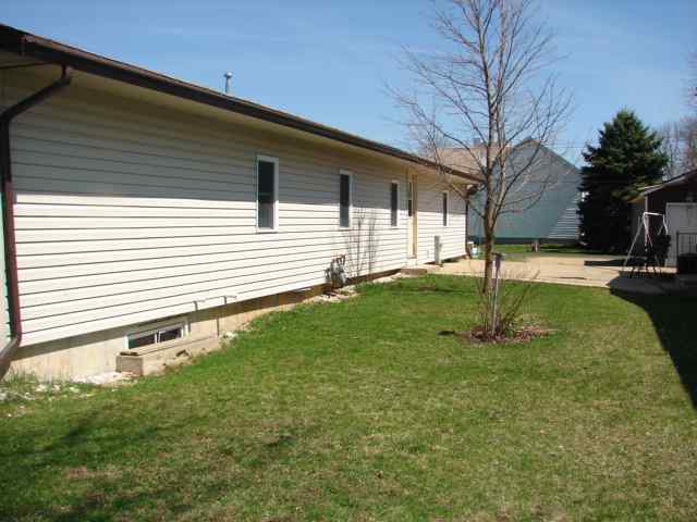 309 Jefferson Street Ridott, IL 61067 - Photo 12 of 12 a backyard of a house with lots of green space