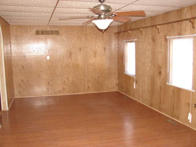 309 Jefferson Street Ridott, IL 61067 - Photo 7 of 12 a view of an empty room with a window