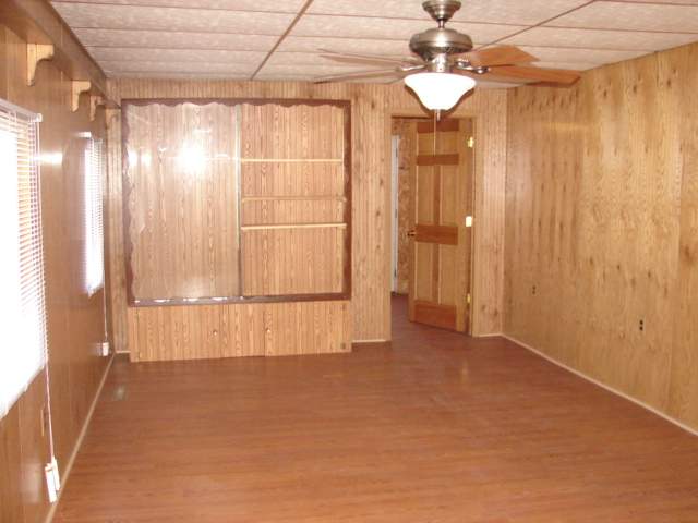 309 Jefferson Street Ridott, IL 61067 - Photo 8 of 12 a view of empty room with a ceiling fan