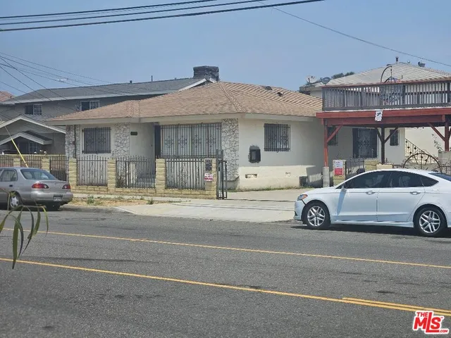 a view of a car parked in front of a building