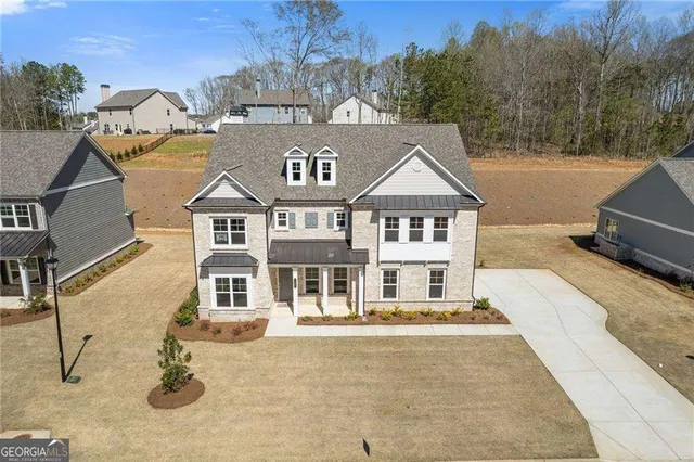 a front view of a house with parking space