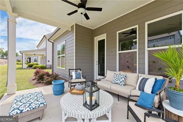 a view of a patio with couches and potted plants