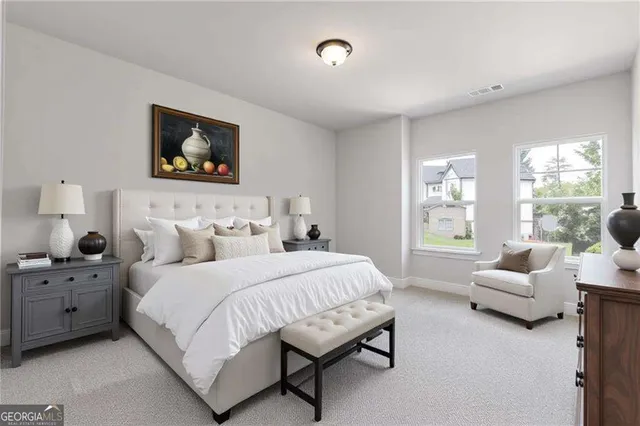 a bedroom with bed and a couch