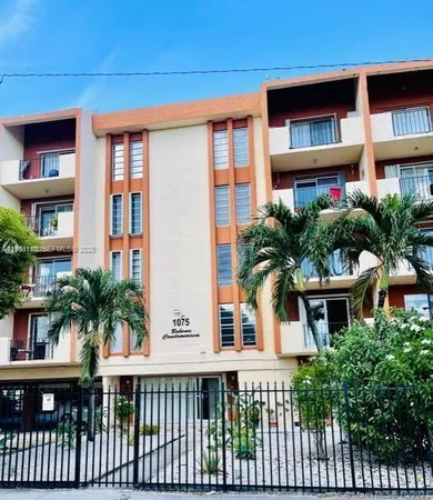 a front view of building with yard