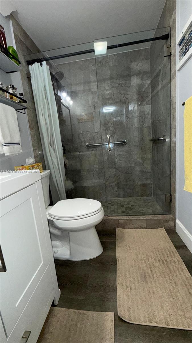 1075 West 68th Street, Unit 403 Hialeah, FL 33014 - Photo 14 of 25 a bathroom with a shower and a toilet