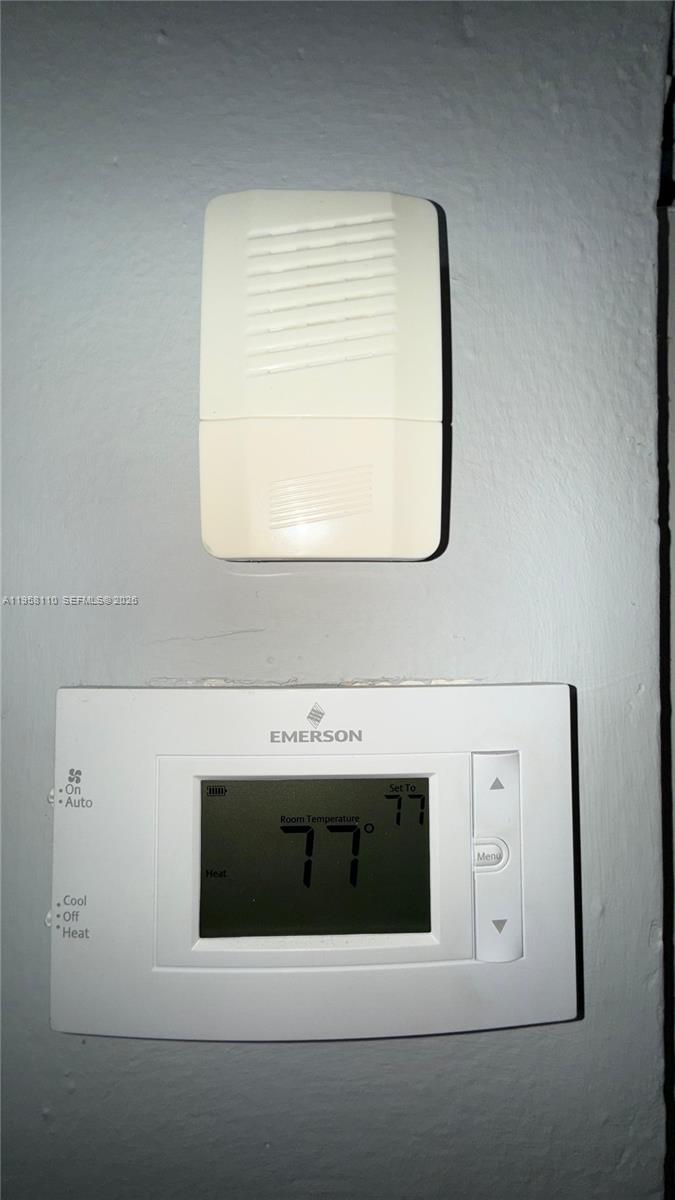 1075 West 68th Street, Unit 403 Hialeah, FL 33014 - Photo 19 of 25 a bathroom with a sink and a mirror