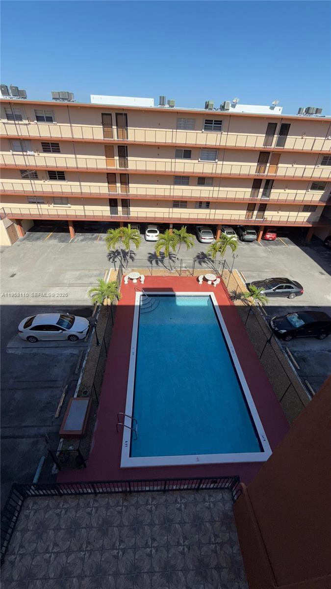 1075 West 68th Street, Unit 403 Hialeah, FL 33014 - Photo 21 of 25 a view of a room with window and a table