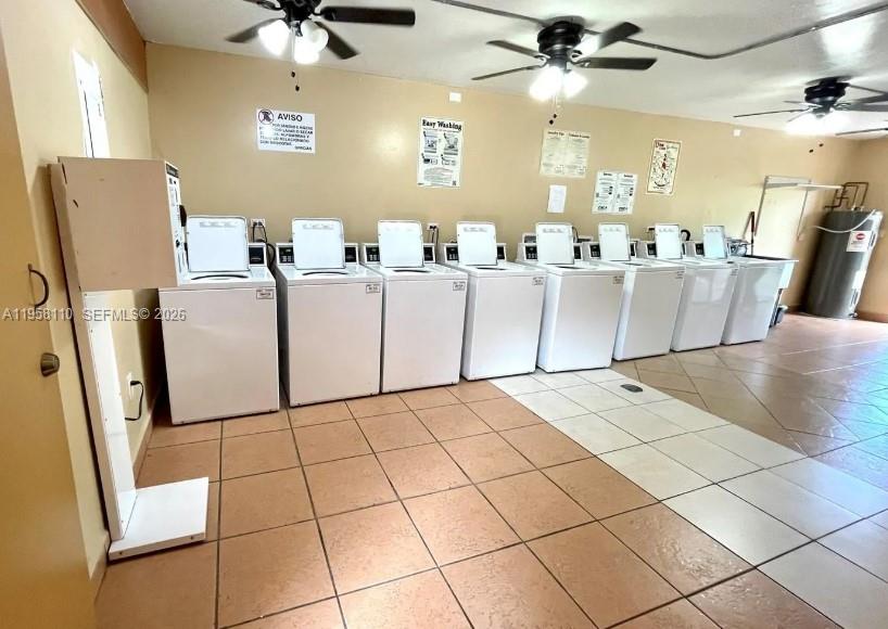 1075 West 68th Street, Unit 403 Hialeah, FL 33014 - Photo 25 of 25 a view of kitchen and empty room with wooden floor