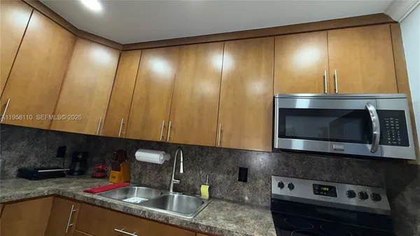 a kitchen with a sink and cabinets