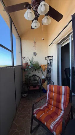 a patio with patio table and chairs