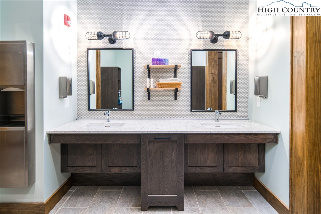 1255 Reynolds Parkway Boone, NC 28607 - Photo 21 of 48 a bathroom with a double vanity sink and a mirror
