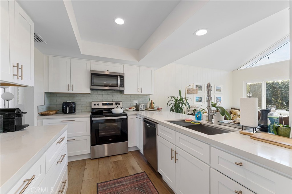 4326 Via Verde Cypress, CA 90630 - Photo 22 of 43 a kitchen with sink a stove and cabinets