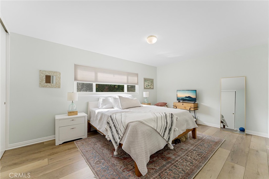 4326 Via Verde Cypress, CA 90630 - Photo 23 of 43 a bedroom with a bed and a large window