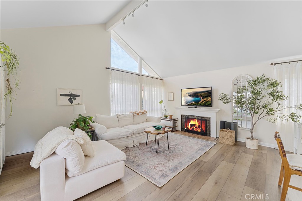 4326 Via Verde Cypress, CA 90630 - Photo 9 of 43 a living room with furniture a fireplace and a flat screen tv