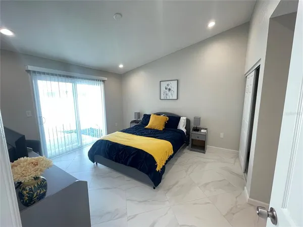 a bed room with a bed and a couch