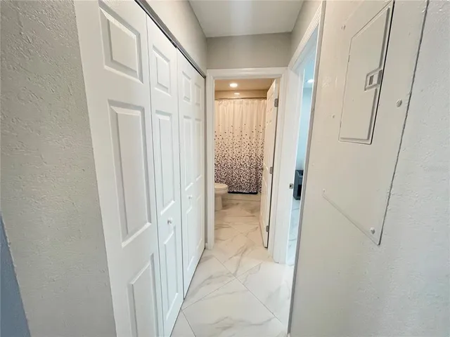 a kitchen with a stove and a refrigerator