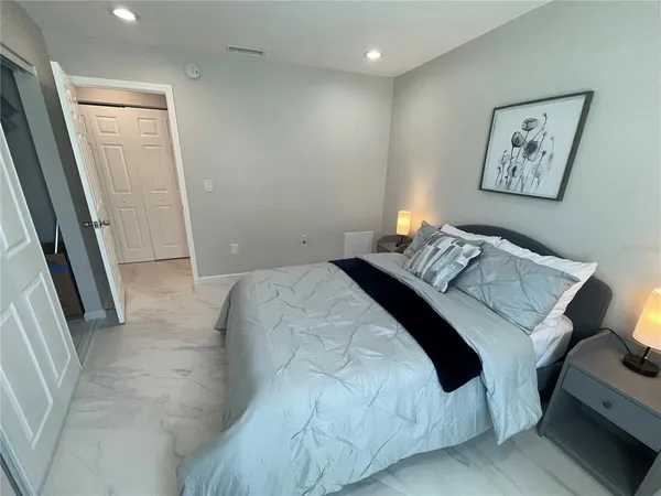 a bathroom with a sink a toilet a mirror and shower curtain