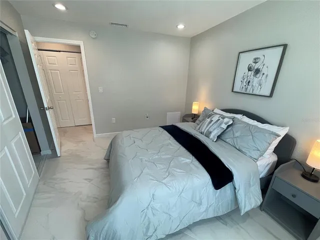 a bathroom with a sink a toilet a mirror and shower curtain