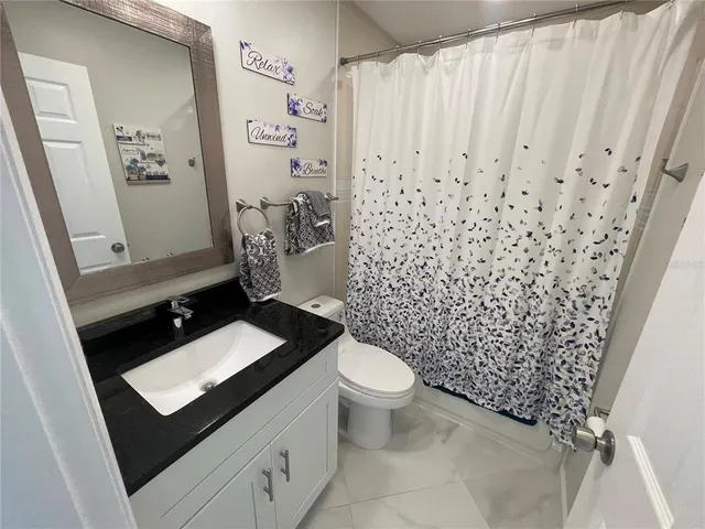 a bathroom with a bathtub and shower