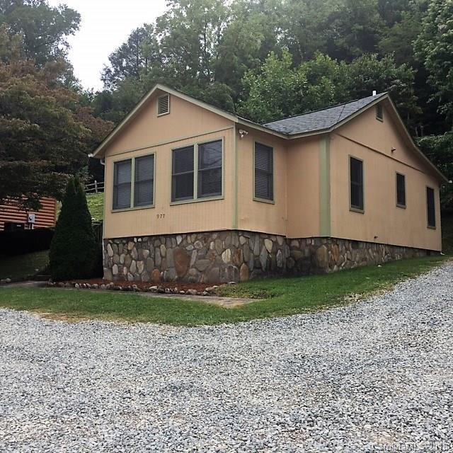 977 Soco Road Maggie Valley, NC 28751 - Photo 1 of 12 a front view of a house with a yard