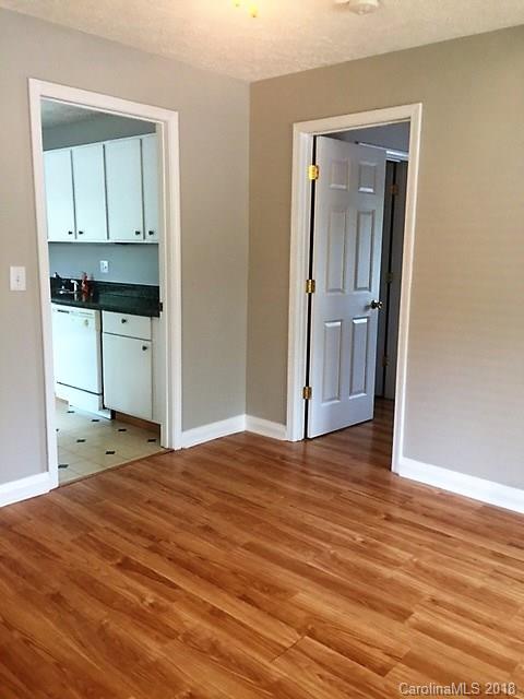 977 Soco Road Maggie Valley, NC 28751 - Photo 10 of 12 a bedroom with a bed and cabinets