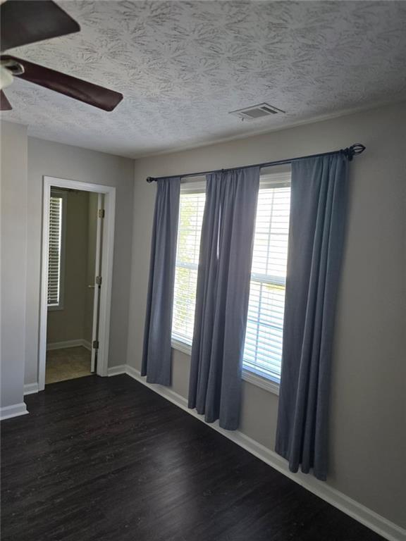 136 Alice Walker Drive Athens, GA 30607 - Photo 6 of 11 an empty room with wooden floor and windows