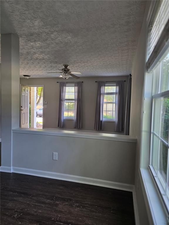 136 Alice Walker Drive Athens, GA 30607 - Photo 9 of 11 a view of an empty room with wooden floor and a window