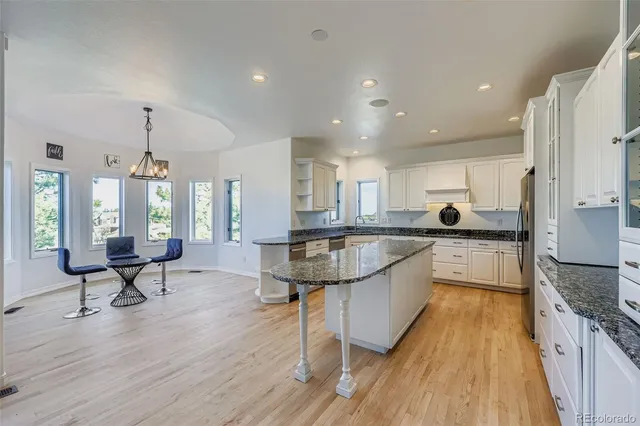 a spacious bedroom with a bed and a fireplace