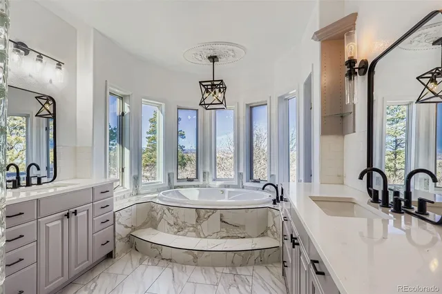 a bedroom with a bed window and wooden floor